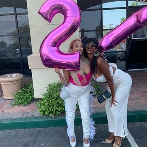 Leather/latex pants with feathers on the side